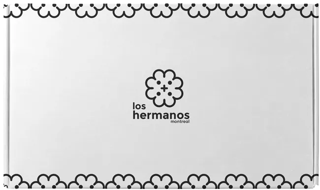 Black and white custom shipping box with Los Hermanos Branding