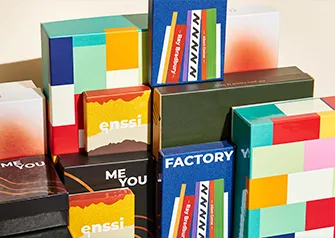 Collection of custom printed rigid boxes with colorful branded designs by Packwire