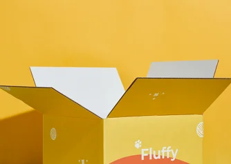Open custom yellow corrugated shipping box on yellow background